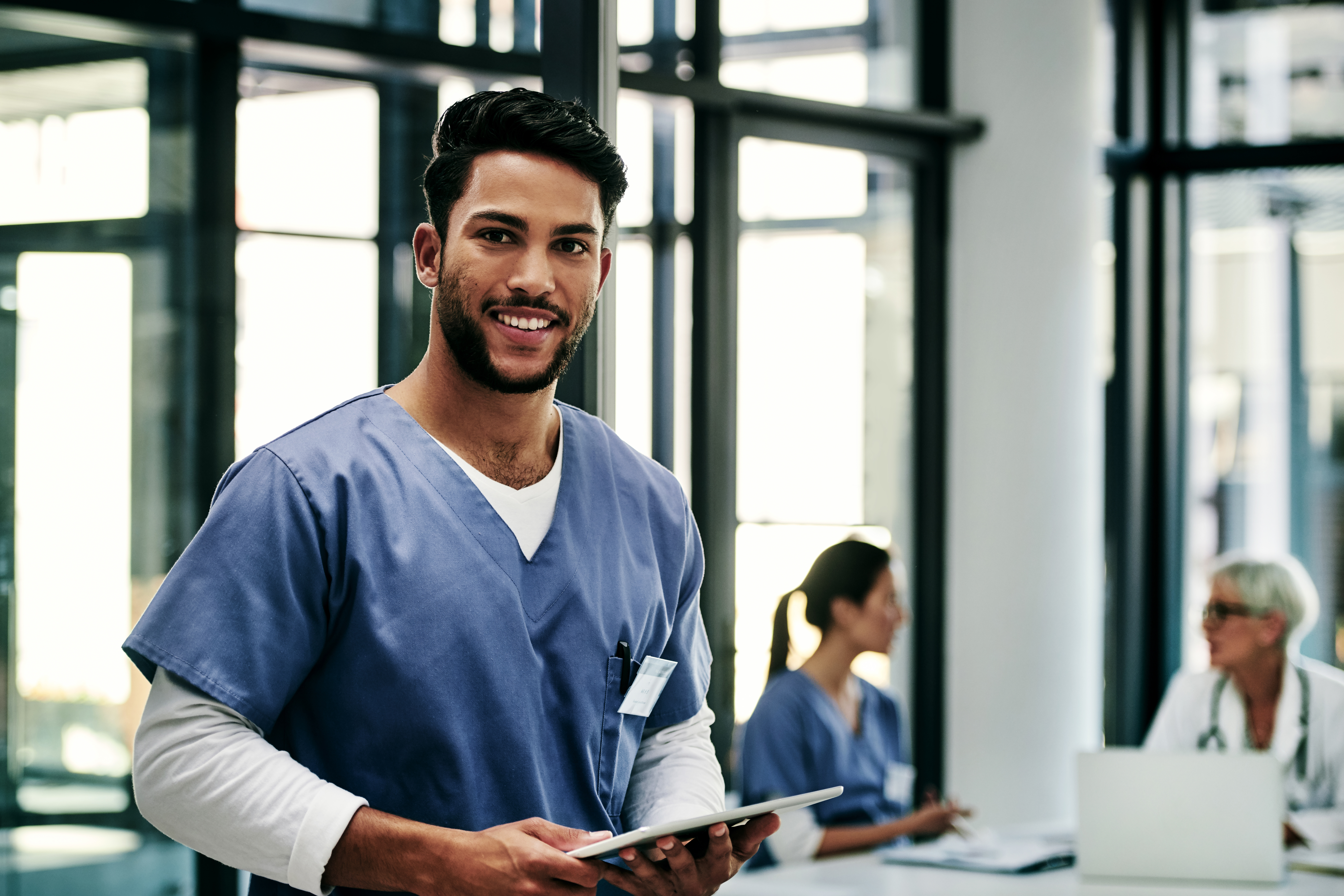 Two medical aide students in a BLS class demonstrates their BLS skills with hospital dummy