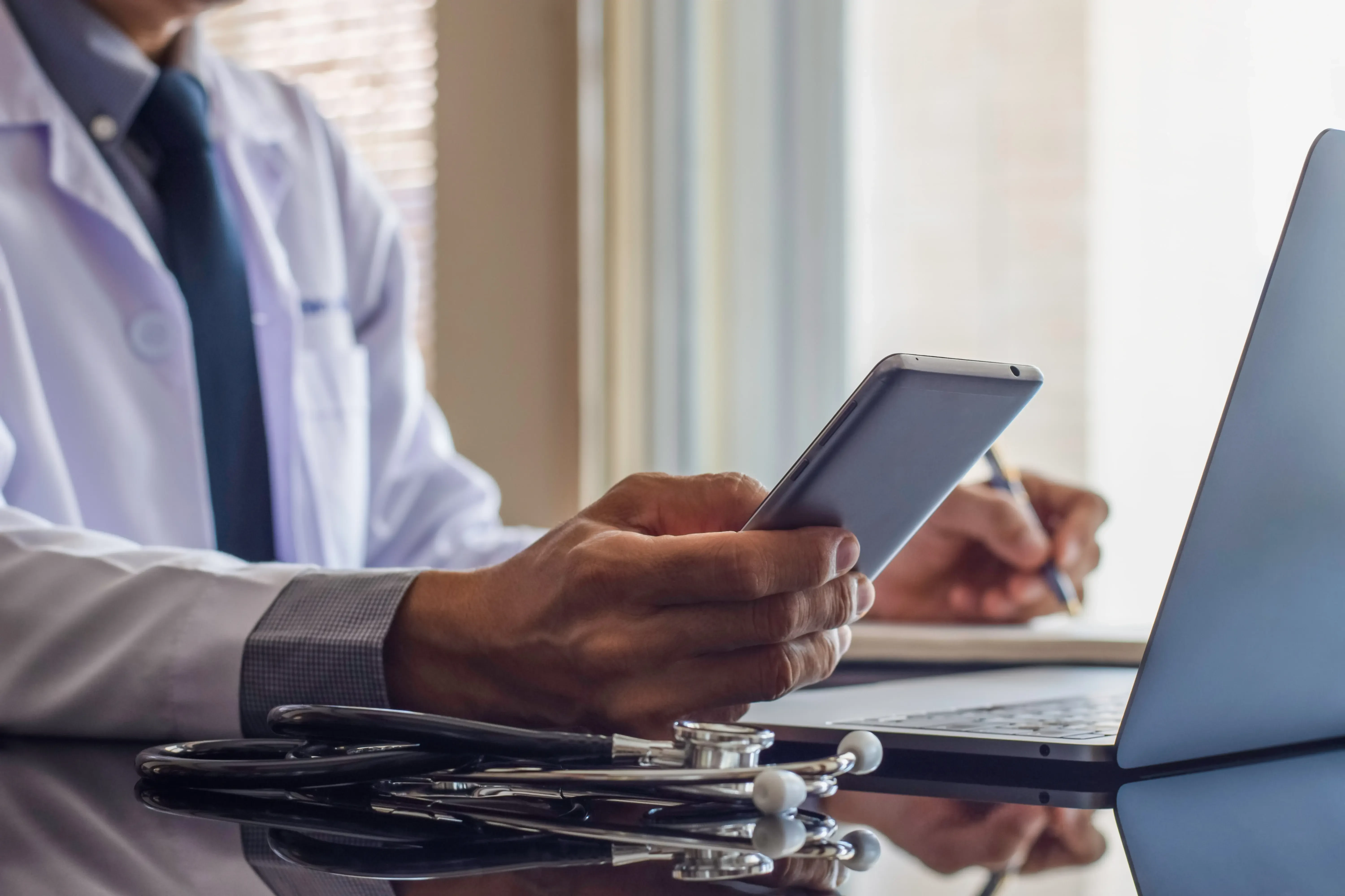Doctor browsing his phone
