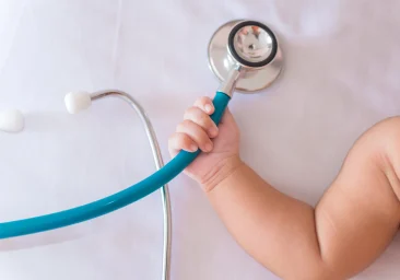Baby holding a stethoscope