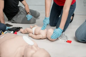 2 finger chest compression on a mannequin