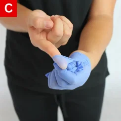 Figure 2c removing the second glove while turning it inside out