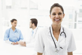 2 doctors talking one facing smiling