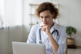 nurse-with-stethoscope-using-laptop