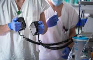 doctor-nurse-holding-defibrillator