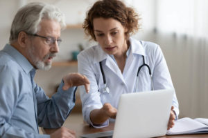 healthcare-professionals-discussion-infront-of-laptop