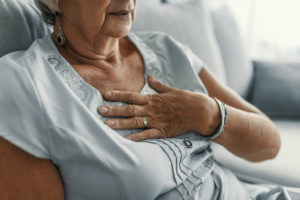 old-woman-holding-her-chest