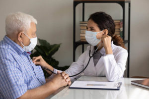 old man consulting a doctor