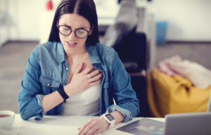 woman-in-pain-holding-her-chest