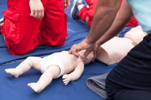 two-persons-demonstarting-infant-cpr