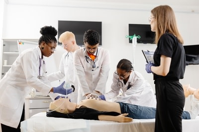 Medical Students performing ACLS on a mannequin