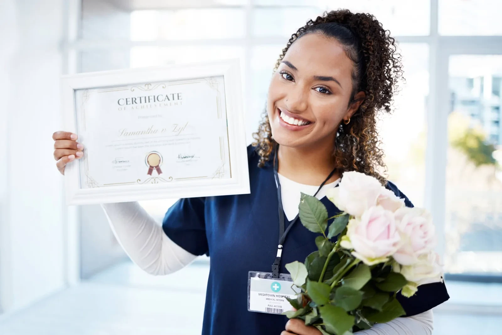 Nurse with a certificate in hand