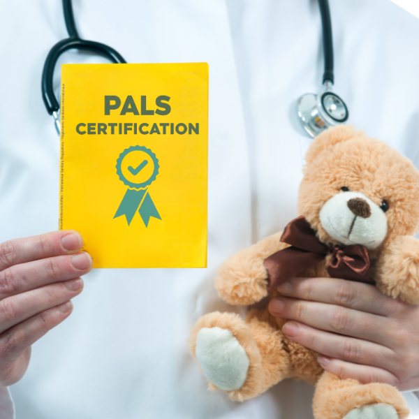 a PALS certified doctor is holding a certificate and a child’s teddy bear