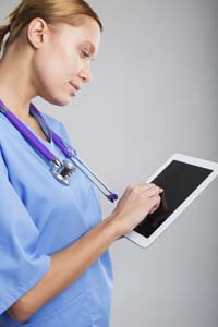 female doctors using ipad mini