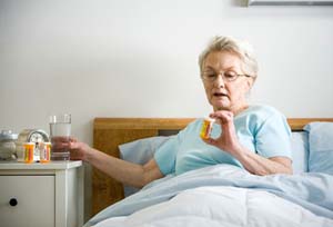 woman post surgery taking heart medication