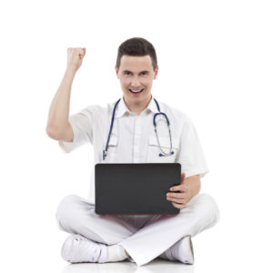 medical student winning on laptop