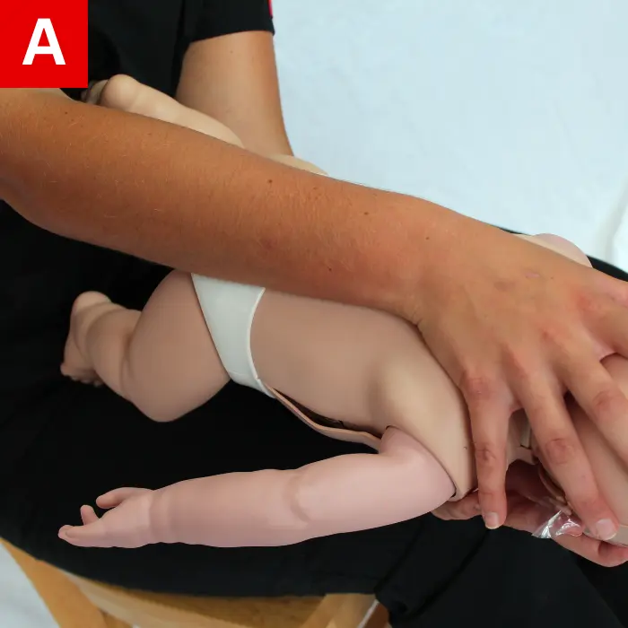 CPR-Figure-28-A Position the infant resting on your forearm