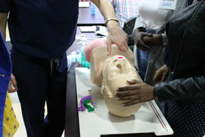 cpr training class with mannequin