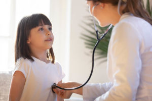 doctor-checking-childs-respiratory-rate