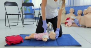 woman-demonstrating-infant-cpr