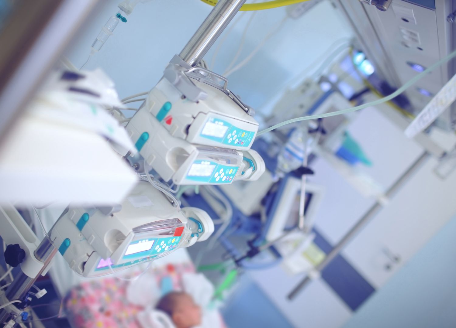 Medical equipment and monitors in a neonatal intensive care unit during a PALS training session.