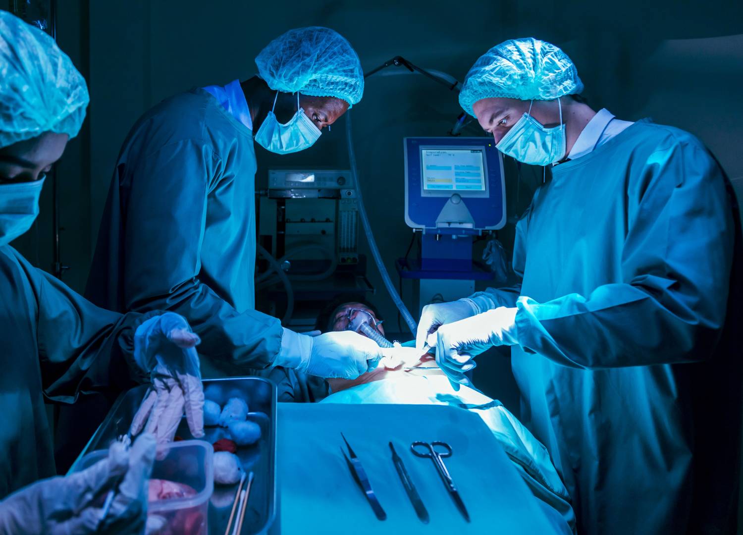 Surgeons performing a cardiac surgery procedure.