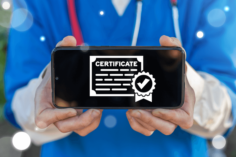 A smartphone screen with icon of certificate displayed by a healthcare professional to signify being certified with ACLS, BLS, PALS