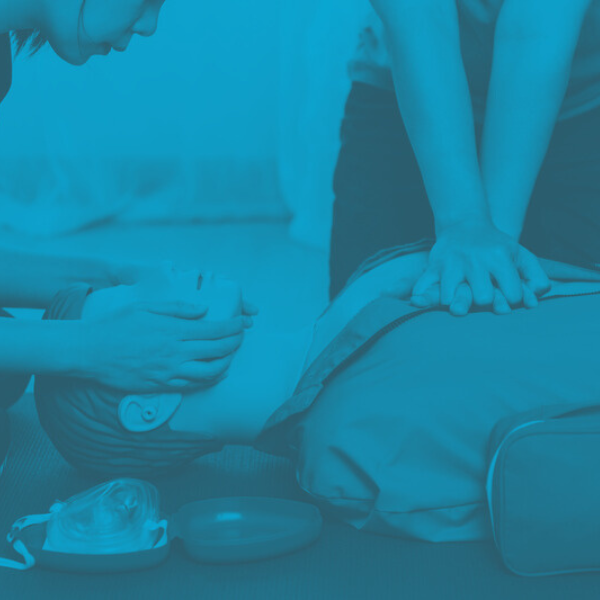 BLS training dummy used by two medical personnel